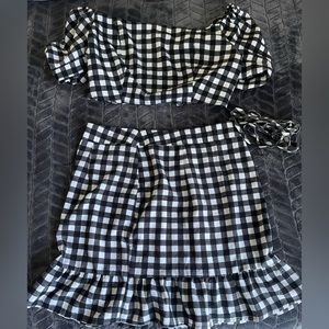 skirt set with top, the part of the top on the back that is tied